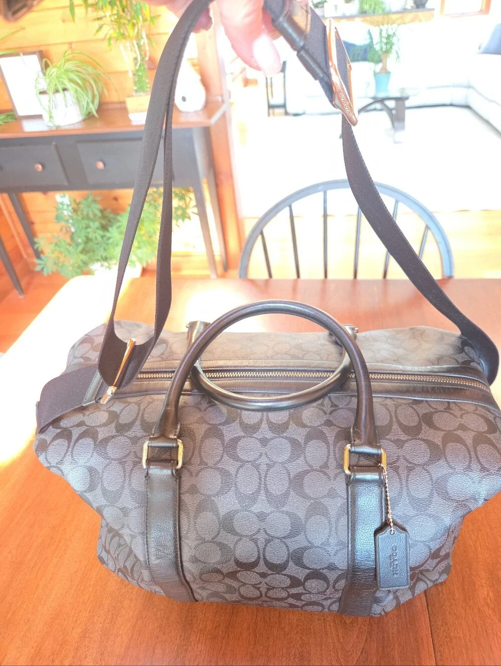 Coach Black Signature Leather Weekender tote bag dark gray and black.